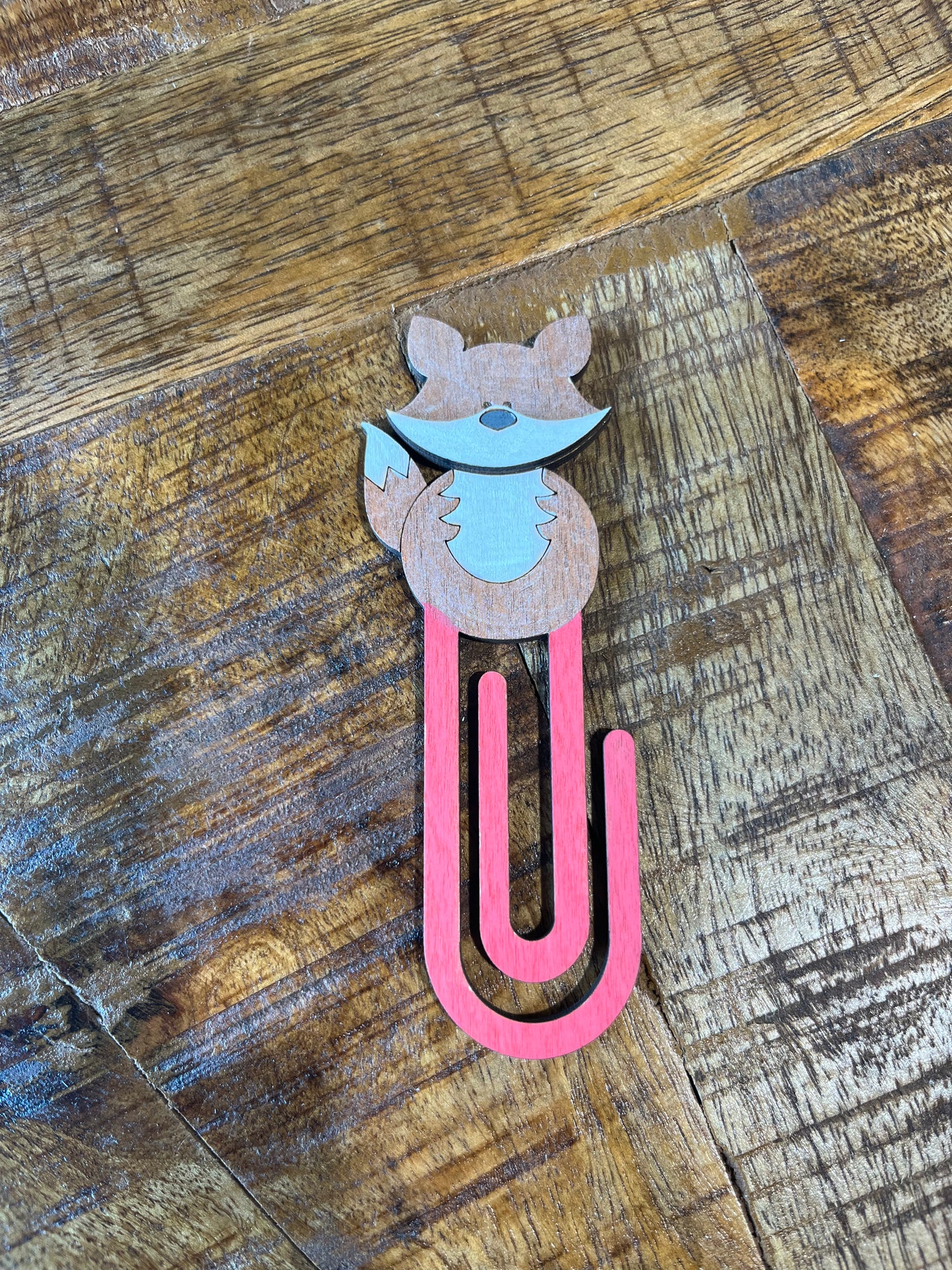 Bookmark with fox design on a wooden surface