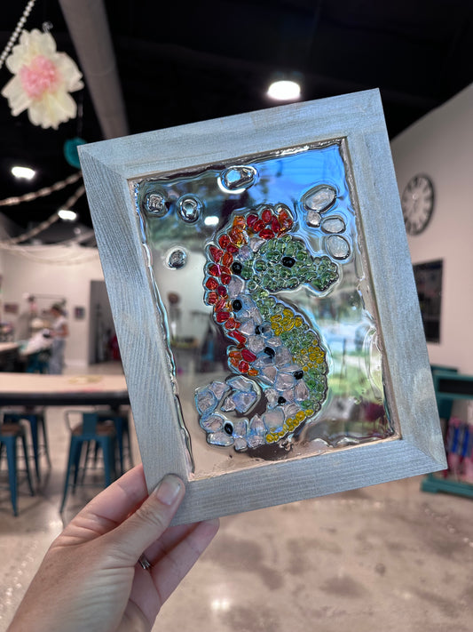 Framed DIY glass art of seahorse, multicolored stones.