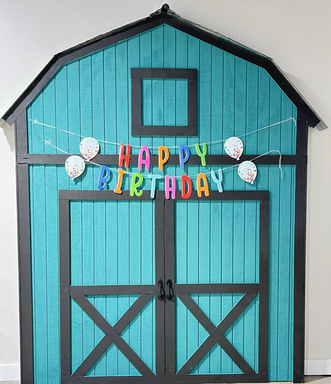 teal barn company maker space barn facade and photo backdrop