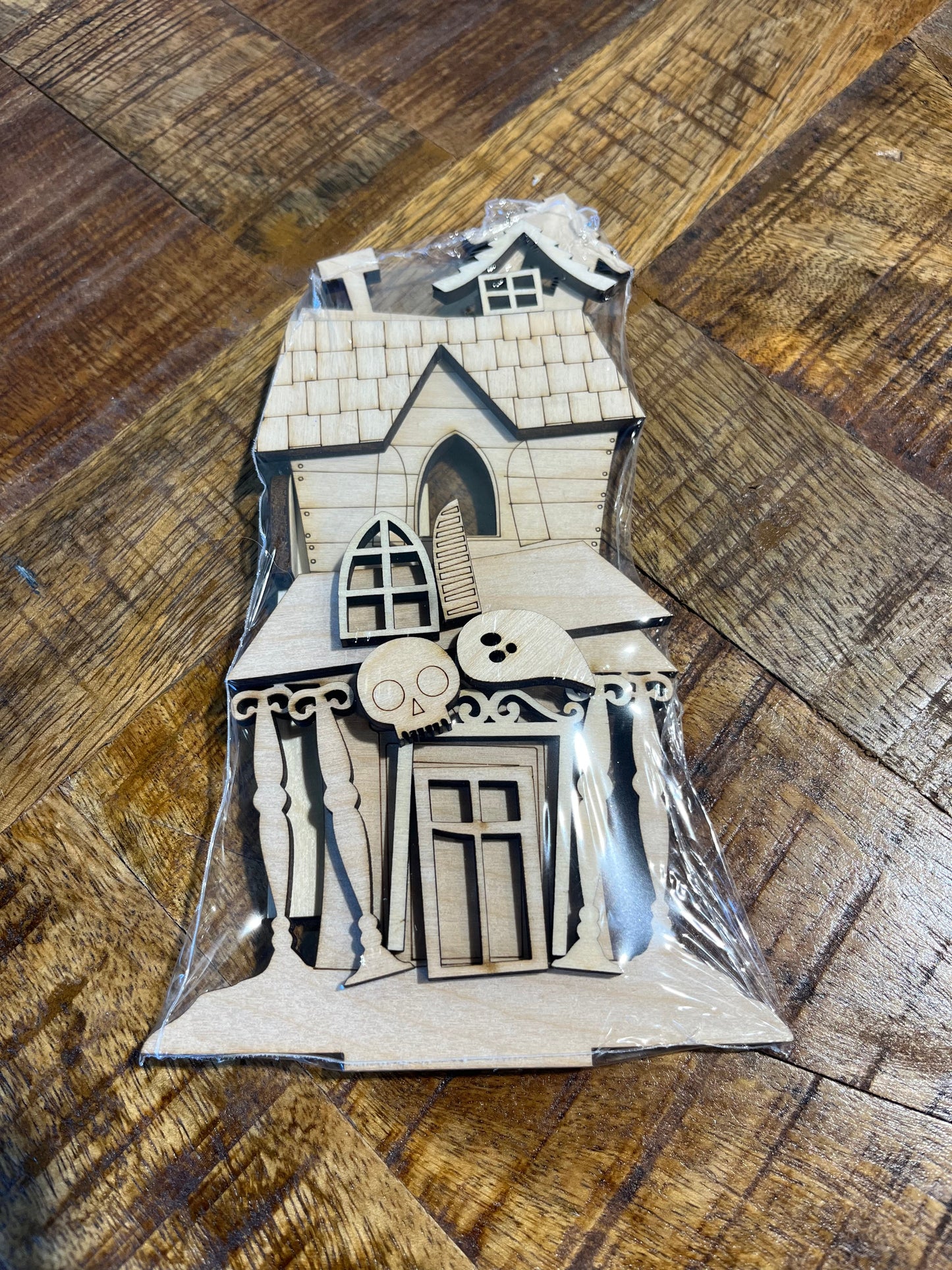 Laser cut shelf decor DIY Kit spooky shaped house with tilted pillars