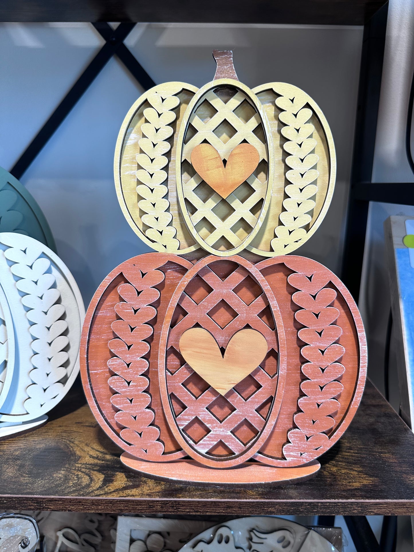 Stacked wood pumpkin decor with a knit pattern that you can paint yourself 