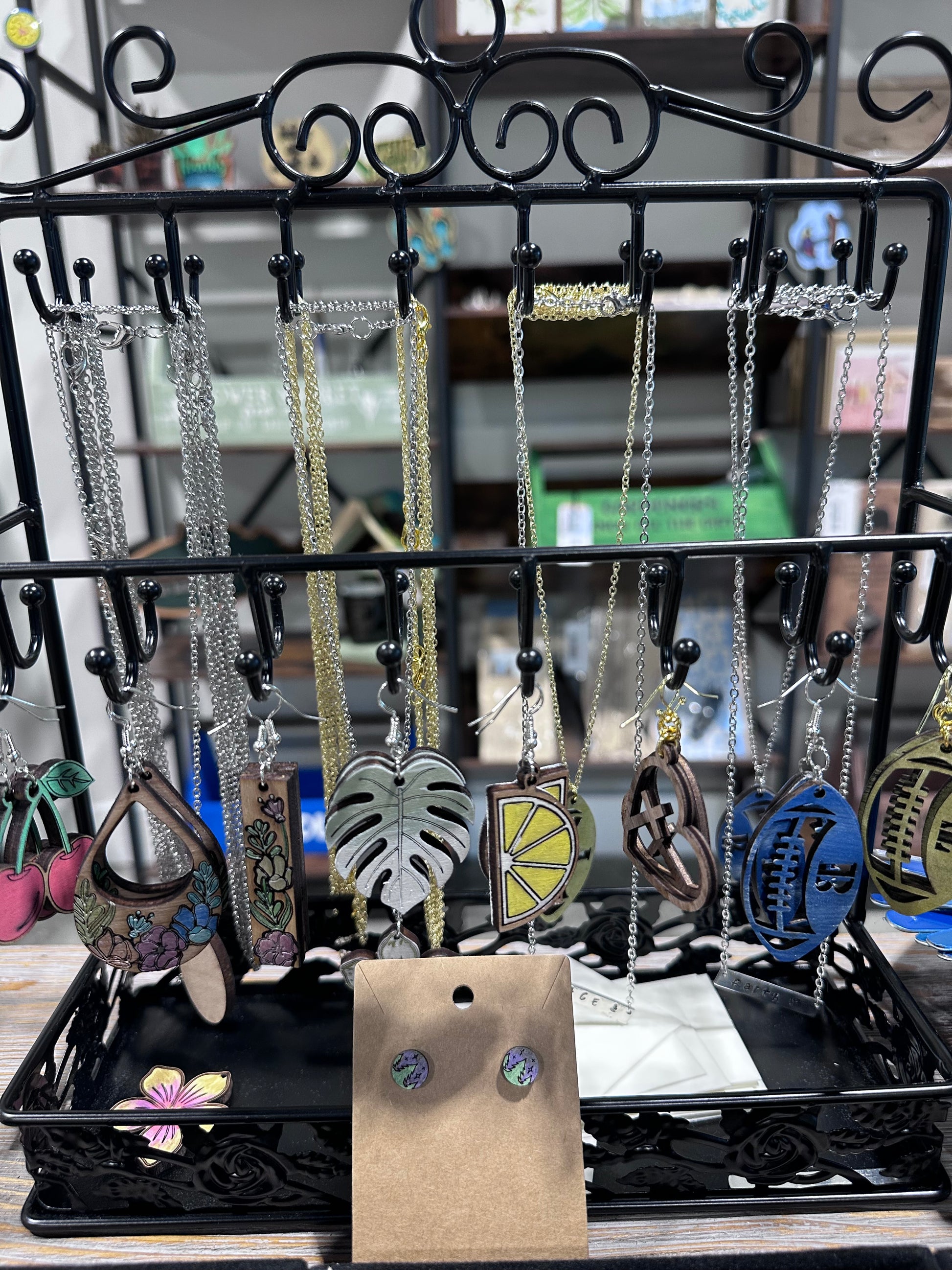 Jewelry display with customizable, high quality laser cut earrings and necklaces.