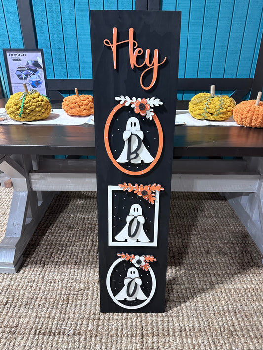 Decorative Halloween sign with ghost designs and pumpkins on a porch. Paint it yourself at our studio in Bremen called Teal Barn Company. 