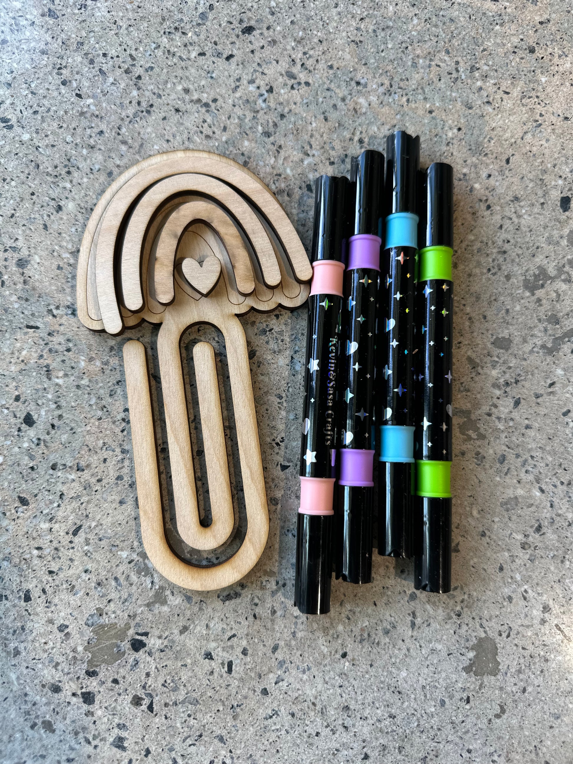 Rainbow bookmark kit that includes a set of paint pens
