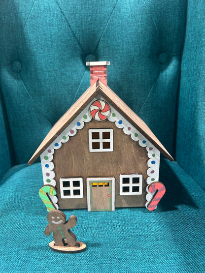 Laser cut gingerbread house featuring traditional gingerbread figure