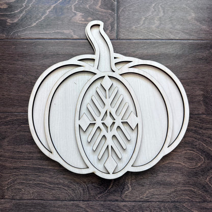 Wooden pumpkin decoration with intricate cut-out design, 3D style boho decor.